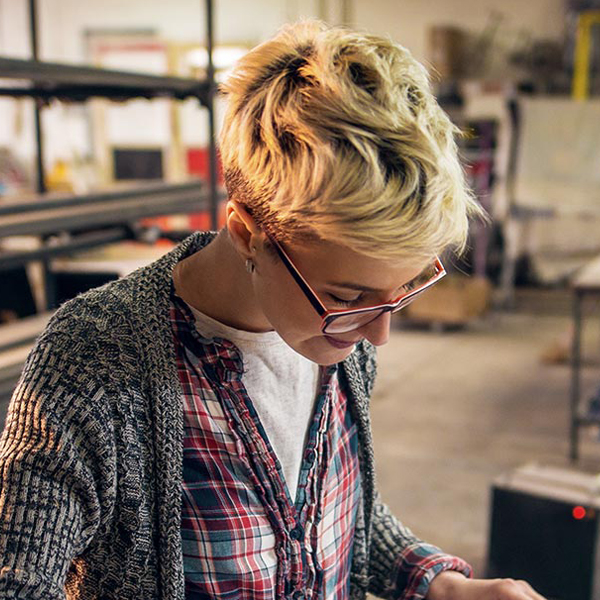 Photo of a woman looking down and studying