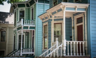 Colorful Victorian style homes with white and green painted trim