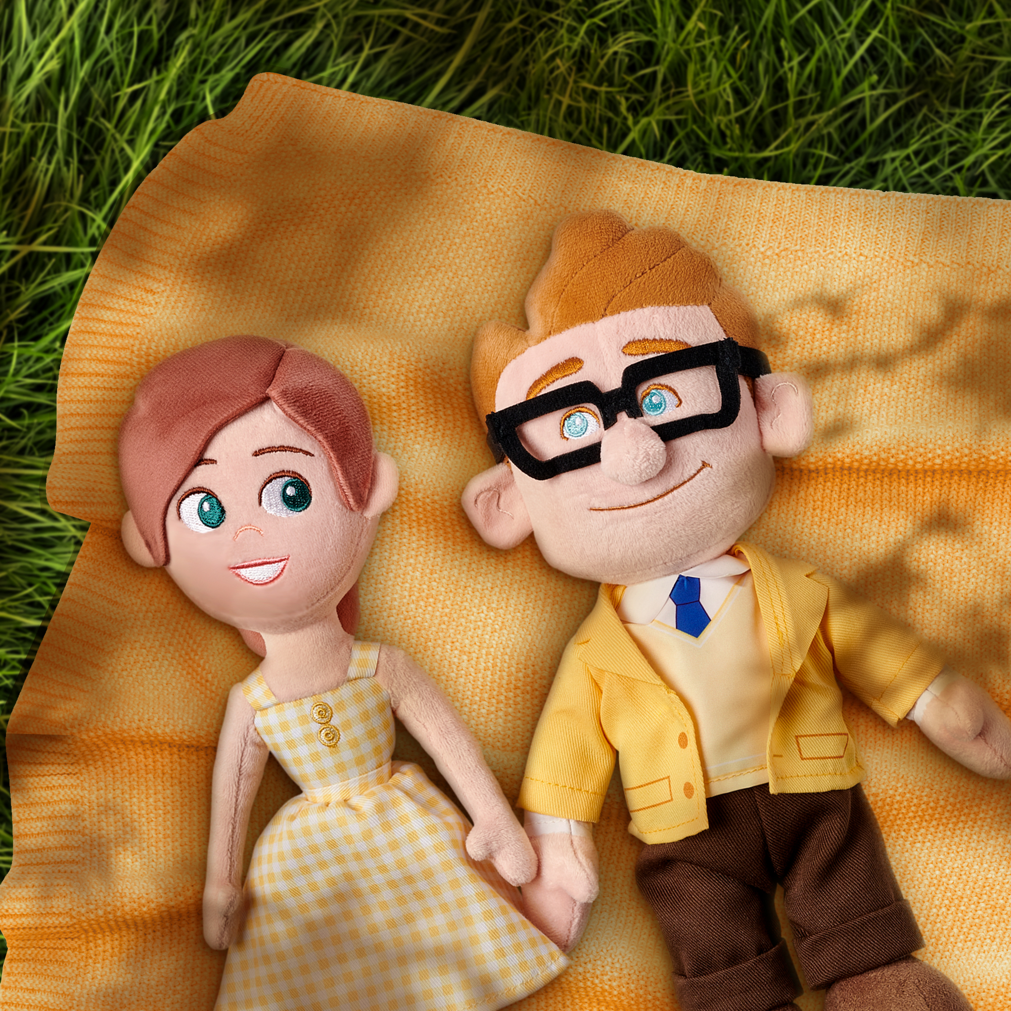 Photo of Carl & Ellie Plush laying on a blanket
