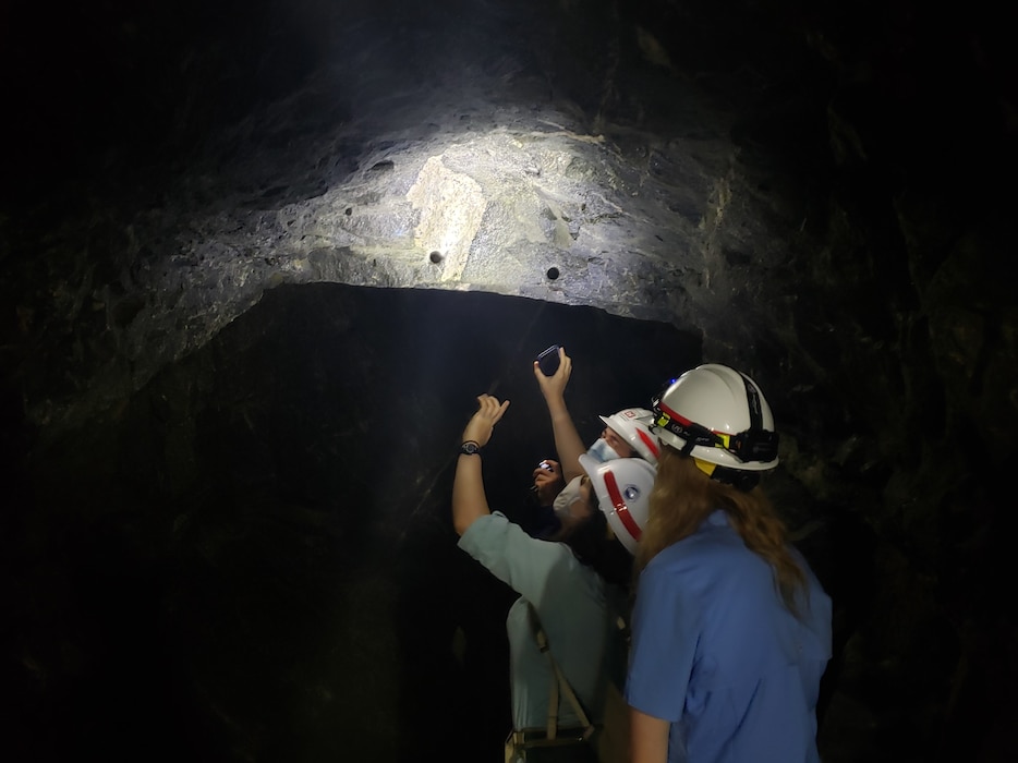 Army Fellows Olivia Finlay, Justin Knight, & Nikki Lorvick examine the Granite Foundation underneath Dworshak Dam.