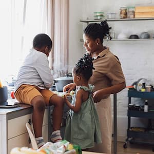 A family cooks together in a kitchen