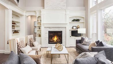 White brick floor to ceiling fireplace in a living room