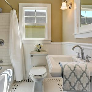 Full bathroom with white tile