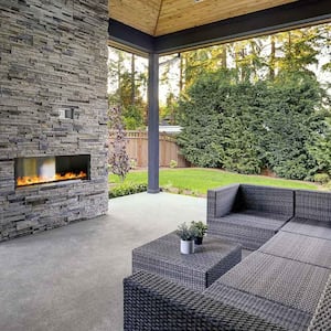 Luxury concrete patio with fireplace