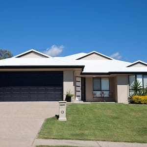 A modern, single story house with a driveway