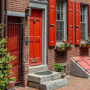 Row of brick houses with a below-ground storm shelter