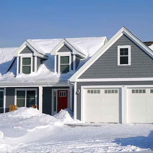 A view of a house exterior in snow