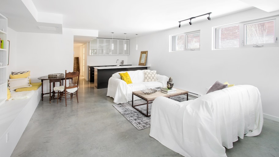 A bright open plan living room basement