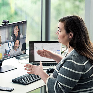 A woman presenting in an online meeting