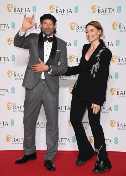 Troy Kotsur (wearing Brunello Cucinelli) and wife Deanne Bray on the BAFTA Awards 2023 red carpet.