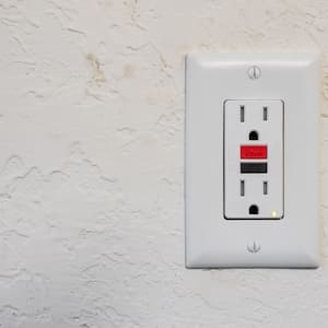 Ground fault interrupter electricity receptacle and wall plate.