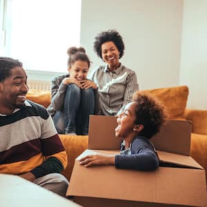 A family packs moving boxes