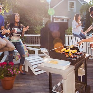 Friends having barbecue on a patio