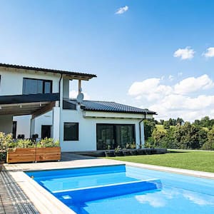 house with large swimming pool in yard