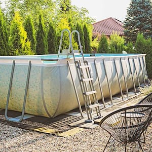 Above ground swimming pool in the pebble garden