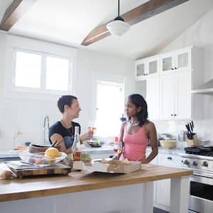 Friends eat in updated kitchen