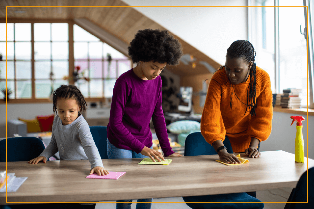 mom and kids cleaning table