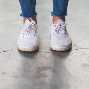 Woman standing on a cracked floor