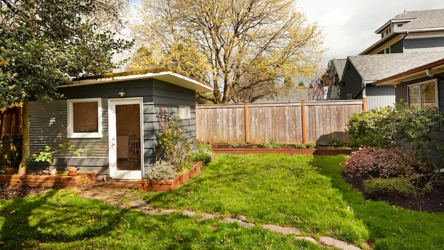 A cute garden shed in backyard