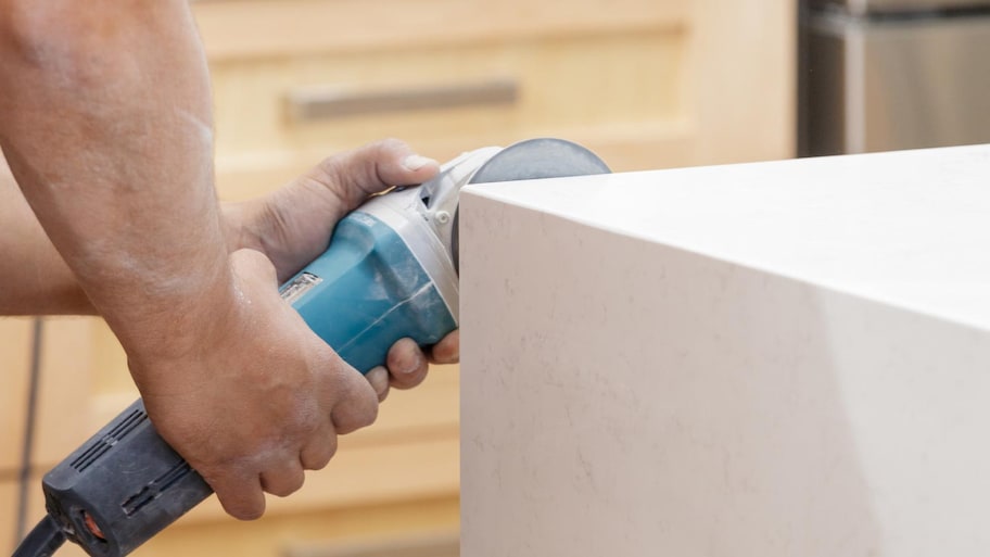 a man installing kitchen countertops