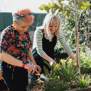 A couple at home gardening in spring