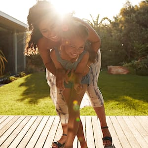 Happy family in sun on deck