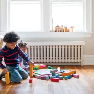 Kids playing with toys on hardwood floor