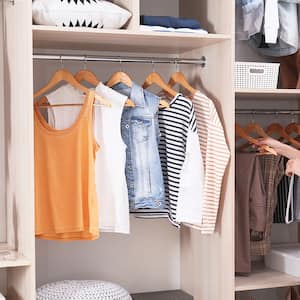 woman looking through wardrobe  