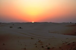 Sunset in a desert. This photo is taken during a desert safari from Dubai, United Arab Emirates nine years ago.