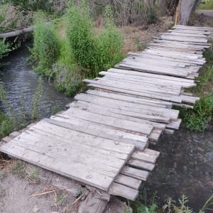 Wooden bridge over a small river