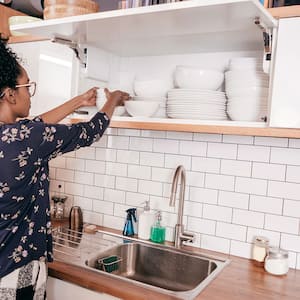 A woman organizes her kitchen