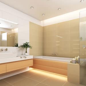 Spacious bathroom in warmer tones with bathtub
