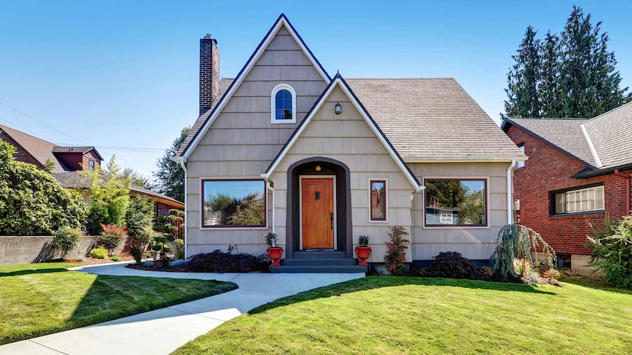 Exterior view of an older home with wood siding