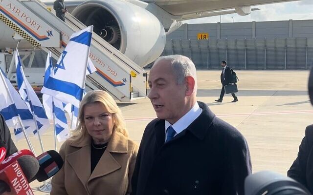 Prime Minister Benjamin Netanyahu (L)) and his wife, Sara, ahead of a flight from Tel Aviv to Paris on February 2, 2023. (Lazar Berman/Times of Israel)