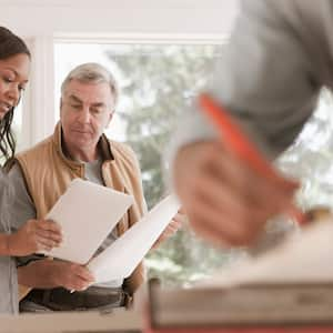  A woman checks the home project with contractor