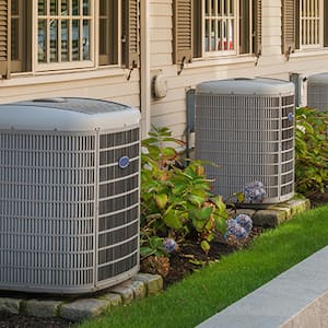 A heating and cooling system situated outdoors