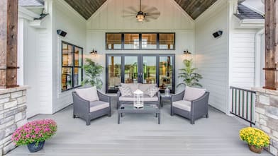 suburban home surrounded by trees  