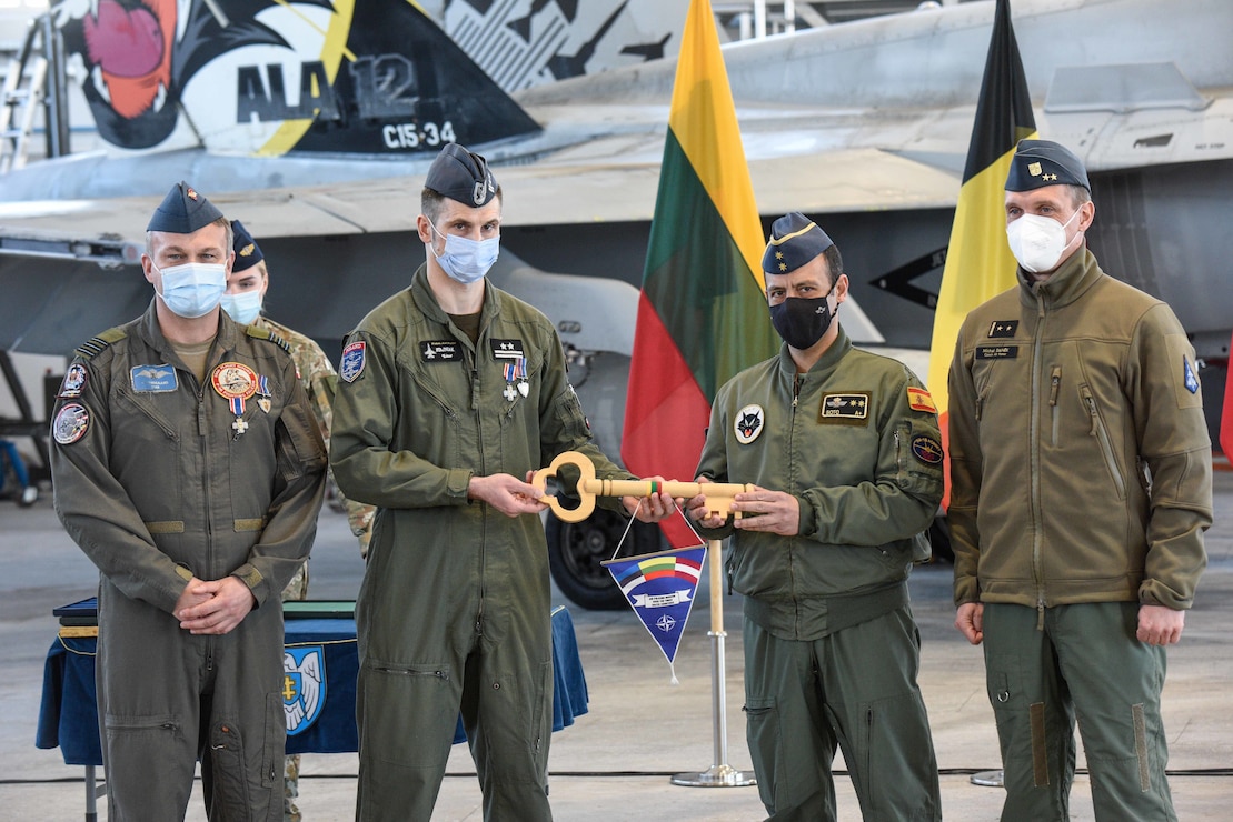 Handover of the symbolic key to the Baltic airspace from Poland and Denmark to Spain and the Czech Republic during official handover ceremonies held at Šiauliai Air Base, Lithuania on March 31. NATO’s collective Air Policing mission in the Baltics is operated primarily out of Amari Air Base and Šiauliai Air Base in Lithuania and benefit from various military construction projects and base improvements managed by the U.S. Army Corps of Engineers, Europe District through the European Deterrence Initiative over the past several years. (Photo courtesy of the Lithuanian Air Force)