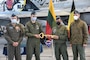 Handover of the symbolic key to the Baltic airspace from Poland and Denmark to Spain and the Czech Republic during official handover ceremonies held at Šiauliai Air Base, Lithuania on March 31. NATO’s collective Air Policing mission in the Baltics is operated primarily out of Amari Air Base and Šiauliai Air Base in Lithuania and benefit from various military construction projects and base improvements managed by the U.S. Army Corps of Engineers, Europe District through the European Deterrence Initiative over the past several years. (Photo courtesy of the Lithuanian Air Force)