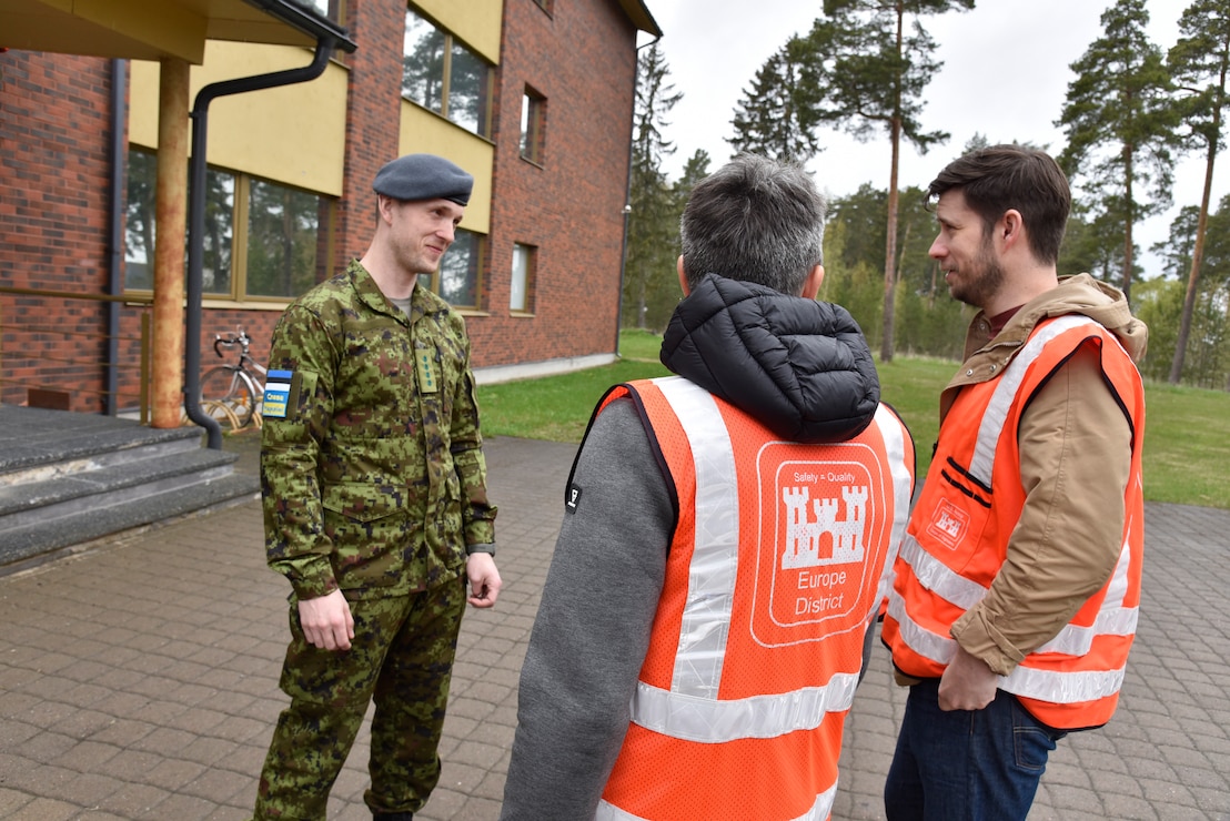 Estonian Air Force Capt. Kaur Käämer discusses U.S. and Estonian partnership and European Deterrence Initiative construction with U.S. Army Corps of Engineers, Europe District Quality Assurance Engineer Jüri Saljukov and Project Engineer Chris Bailey at Amari Air Base in Estonia May 12, 2022. Over the past several years, the U.S. Army Corps of Engineers has delivered various projects in Estonia and neighboring Baltic countries Latvia and Lithuania through the European Initiative (EDI). Under the EDI program military infrastructure is built to enhance the U.S. deterrence posture, increase the readiness and responsiveness of U.S. forces in Europe, support the collective defense and security of NATO allies, and bolster the security and capacity of U.S. allies and partners. (U.S. Army photo by Chris Gardner)