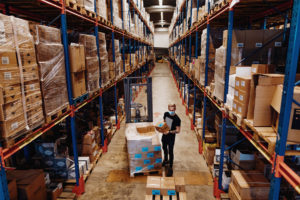 WAREHOUSE WORKER HANDLING RETAIL STOCK