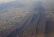 Oblique air photo of Massanutten Mountain, looking southwest. The south fork of the Shenandoah River is visible to the left, as well as a part of the Blue Ridge Mountains.