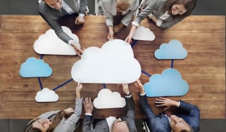 crowd of people around table with clouds