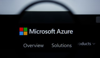 Microsoft Azure logo on a black background through a magnifying glass