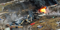 Portions of a Norfolk Southern freight train that derailed Feb. 3, in East Palestine, Ohio, are still on fire on Feb. 4, 2023.