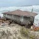 This photo provided by the National Park Service shows a collapsed one-story house in Rodanthe, N.C. (National Park Service via AP)