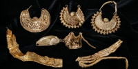 Four gold earrings and two ribbed gold strips from 1000-1050 AD. 