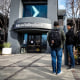 Image: People line up outside of a Silicon Valley Bank office on March 13, 2023 in Santa Clara, Calif.