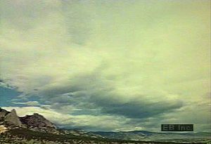 View a time-lapse video of cloud formations rolling across the sky followed by a thunderstorm