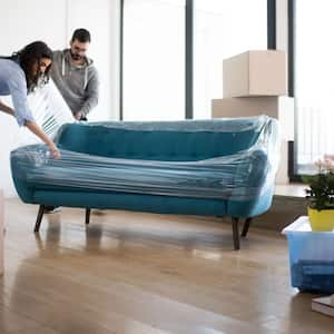 Couple wrapping sofa with protective plastic